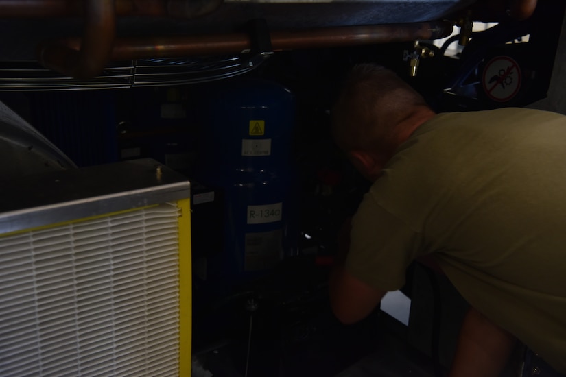 Senior Airman Spencer Cook, 437th Maintenance Squadron Aerospace Ground Equipment technician, conducts an acceptance inspection on a TLD manufactured air conditioner at Joint Base Charleston S.C., June 3, 2020. Members of the 437th MXS accept, fix and maintain equipment used on aircraft and in back shops to do maintenance inspections in order to keep the flight line a more lethal and ready force.