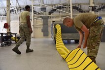Senior Airman Spencer Cook, 437th Maintenance Squadron Aerospace Ground Equipment technician, inspects the cooling air duct on a TLD manufactured air conditioner at joint base Charleston S.C., June 3, 2020. Members of the 437th MXS accept, fix and maintain equipment used on aircraft and in back shops to do maintenance inspections in order to keep the flight line a more lethal and ready force.