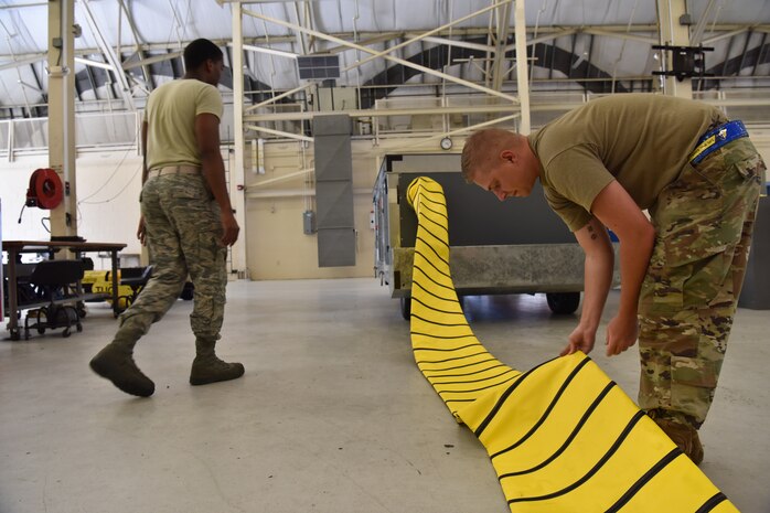 Senior Airman Spencer Cook, 437th Maintenance Squadron Aerospace Ground Equipment technician, inspects the cooling air duct on a TLD manufactured air conditioner at joint base Charleston S.C., June 3, 2020. Members of the 437th MXS accept, fix and maintain equipment used on aircraft and in back shops to do maintenance inspections in order to keep the flight line a more lethal and ready force.