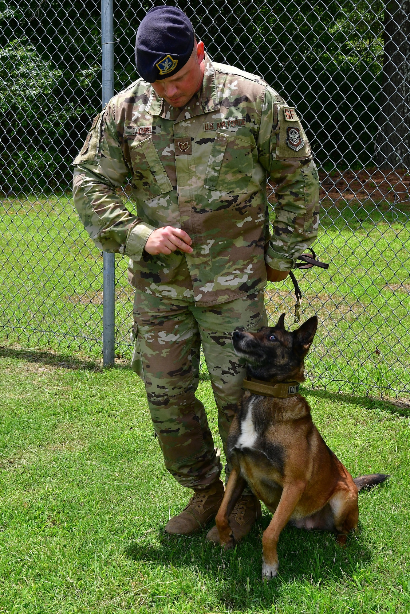 Tech. Sgt. Brooks Jones, 19th Security Forces Squadron military working dog trainer and handler, and MWD Alfa, prepare for the obedience training course at Little Rock Air Force Base.
