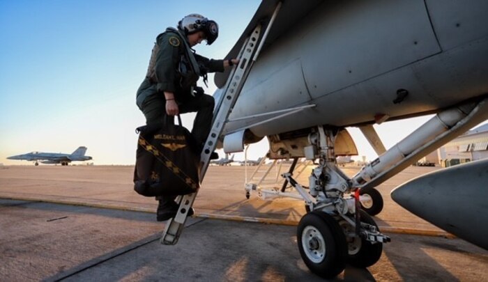 A U.S. Marine embarks an F/A-18C Hornet at Marine Corps Air Station Miramar, Calif., May 2.