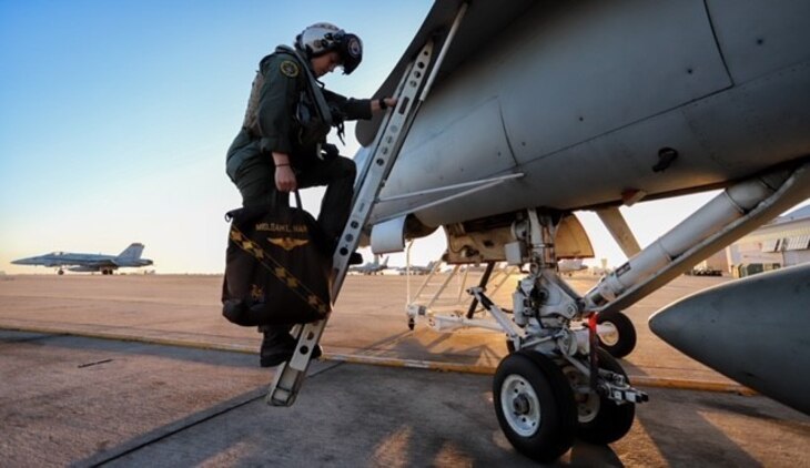 A U.S. Marine embarks an F/A-18C Hornet at Marine Corps Air Station Miramar, Calif., May 2.