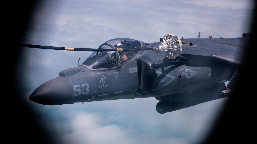 A U.S. Marine Corps AV/8B Harrier conducts an aerial refuel from a KC-130J Super Hercules in the US Central Command area of responsibility, April 28.