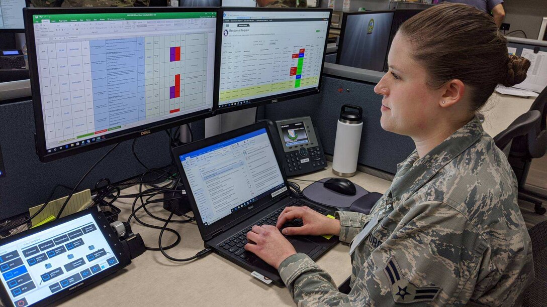 Airman 1st Class Alyssa Meyers, 115th Fighter Wing emergency manager, works at her desk in the Joint Operations Center at the Wisconsin National Guard headquarters in Madison, Wis., June 4, 2020.