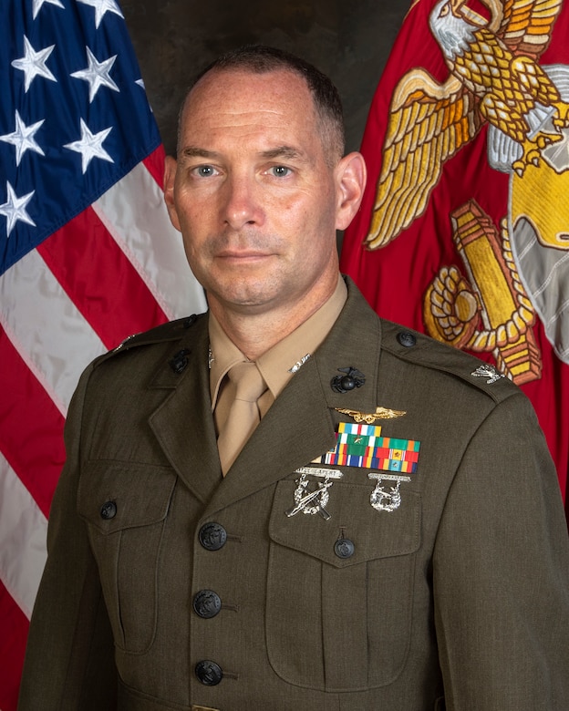 Official photo for Colonel William P. Donnelly III at Naval Air Station, Corpus, Christi Texas. Photo taken in Service Alphas with American Flag backdrop.