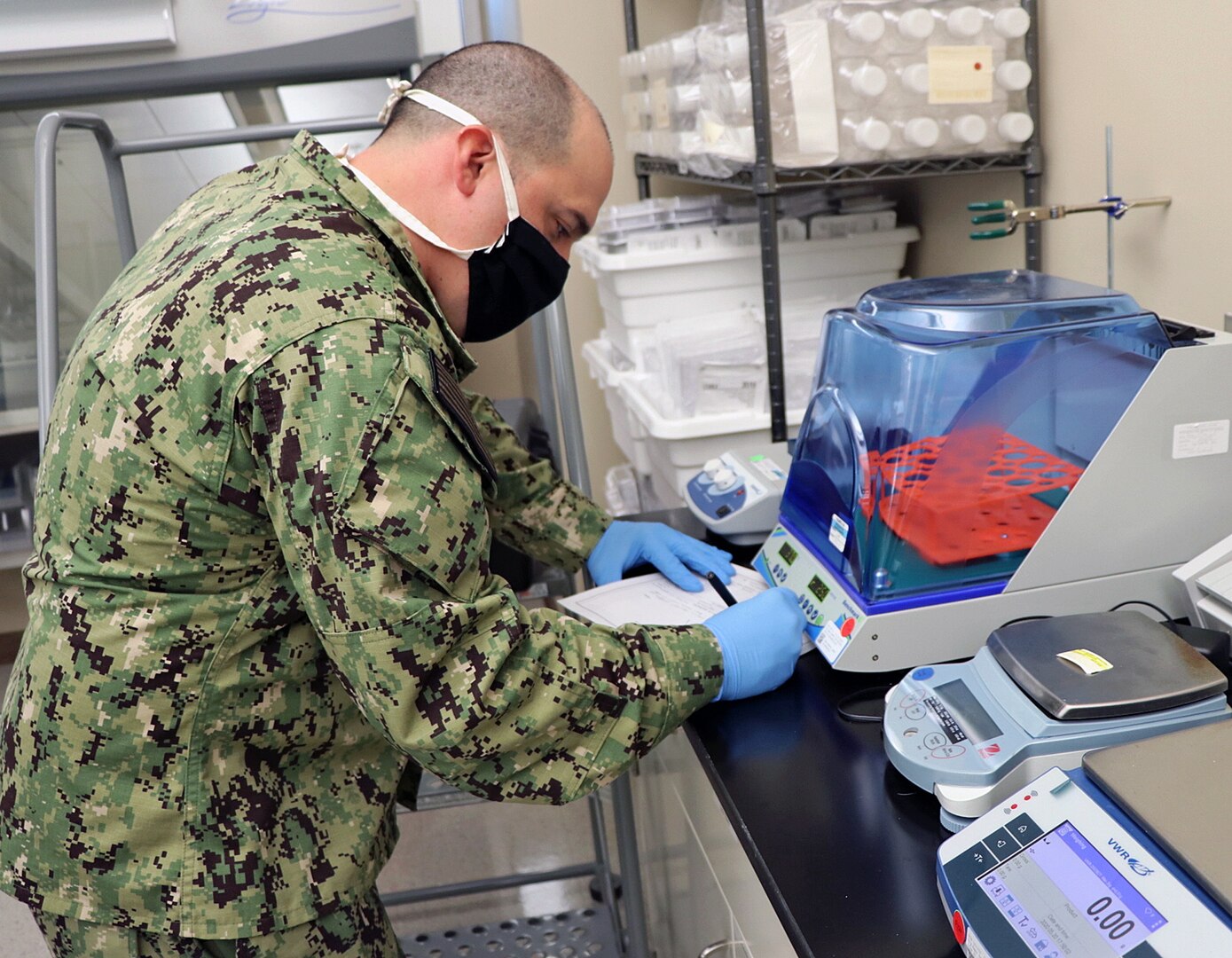 Sailor inspects lab equipment