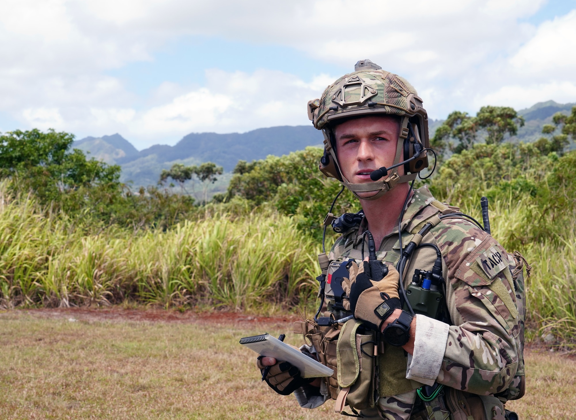 U.S. Air Force Staff Sgt. Derek Skelton, 25th Air Support Operations Squadron Tactical Air Control Party Airman, tests his equipment on Wheeler Army Airfield, Hawaii, June 5, 2020. TACP Airmen undergo extensive physical, mental, and technical training to ensure they can do their job well. (U.S. Air Force photo by Airman 1st Class Erin Baxter)