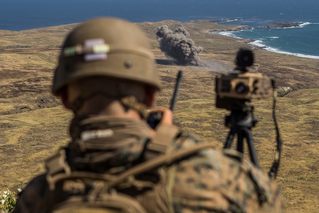 A U.S. Marine observes effects of an explosion during a field exercise on San Clemente Island, Calif., May 8.
