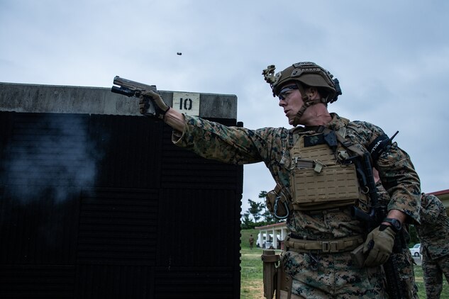 A special amphibious reconnaissance corpsman fires his M45A1 service pistol during a stress shoot as part of a close-quarters tactics range on Camp Hansen, Japan May 14.