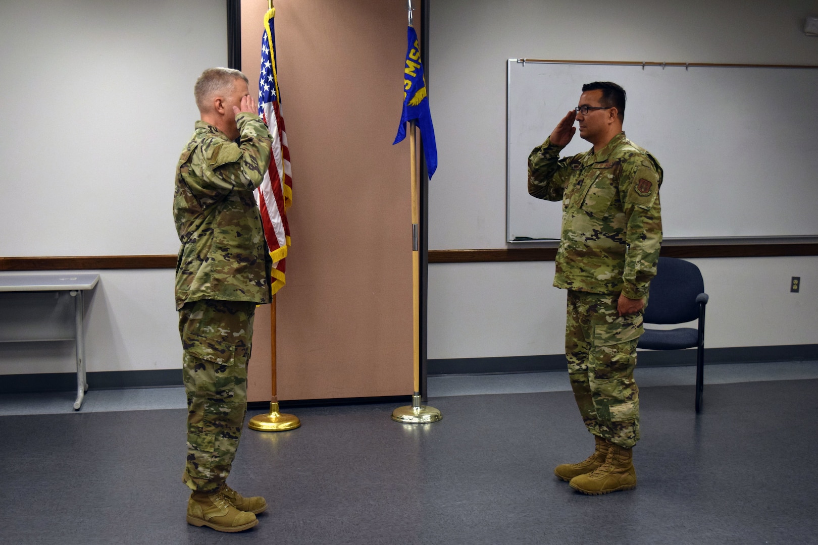 Lt. Col. Brian A. Angell, 433rd Logistics Readiness Squadron commander (right), salutes Col. Wayne M. Williams, 433rd Mission Support Group commander, during a change of command ceremony at Joint Base San Antonio-Lackland, Texas, June 6, 2020.
