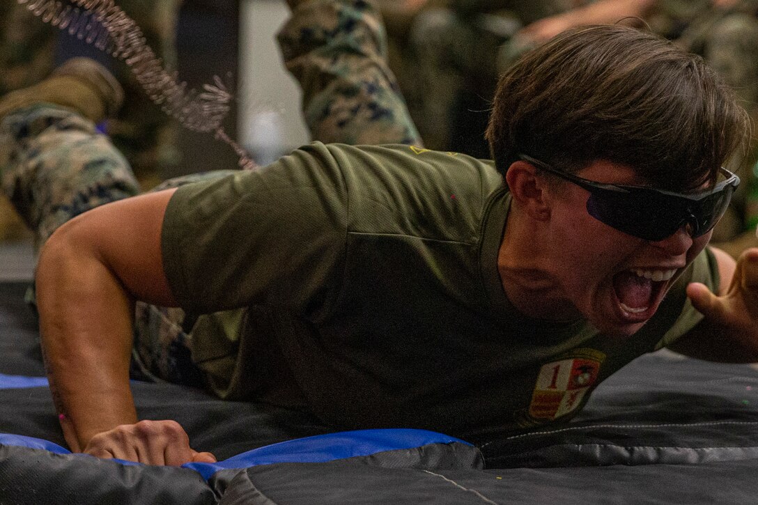 A U.S. Marine endures a taser shock during a non-lethal weapons course at Marine Corps Base Camp Pendleton, Calif., May 21.