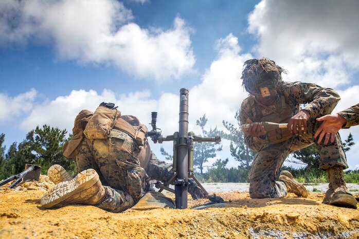 U.S. Marines prepare to fire a round from a 60mm mortar during training on Camp Hansen, Japan, May 4.