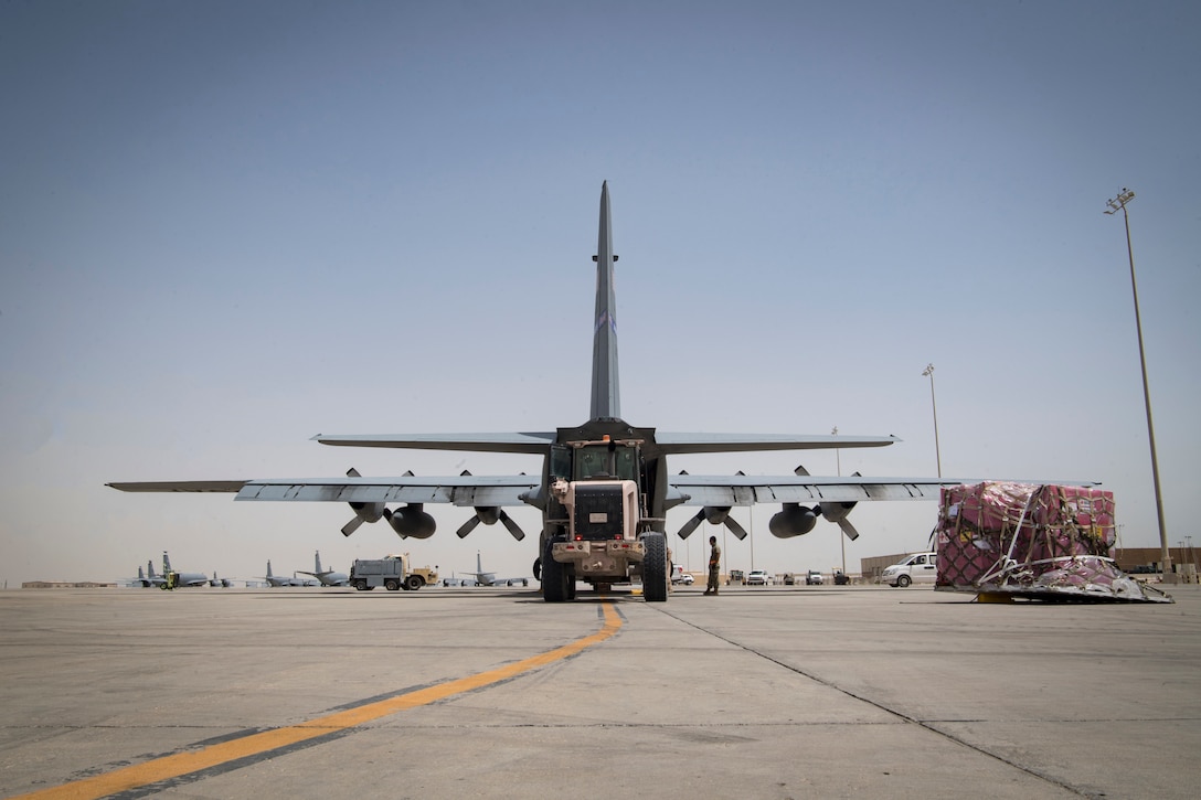 Cargo is loaded onto an air transport plane.