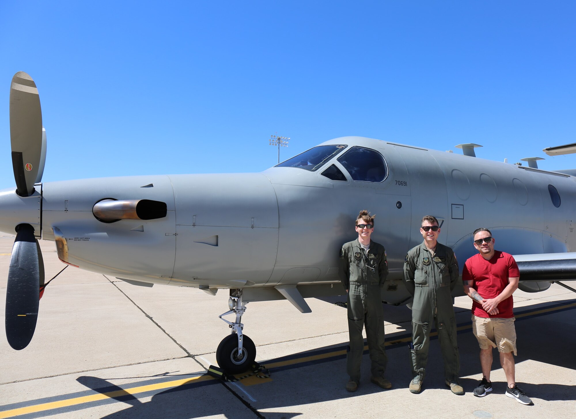 Members of the 318th Special Operations Squadron pose for a photo in front of a PC-12 Mustang at Cannon Air Force Base, New Mexico, May 20, 2020. The crew safely delivered over 100 nasal swabs from deployers to Lackland Air Force Base, Texas, to be tested for COVID-19. (Courtesy Photo)