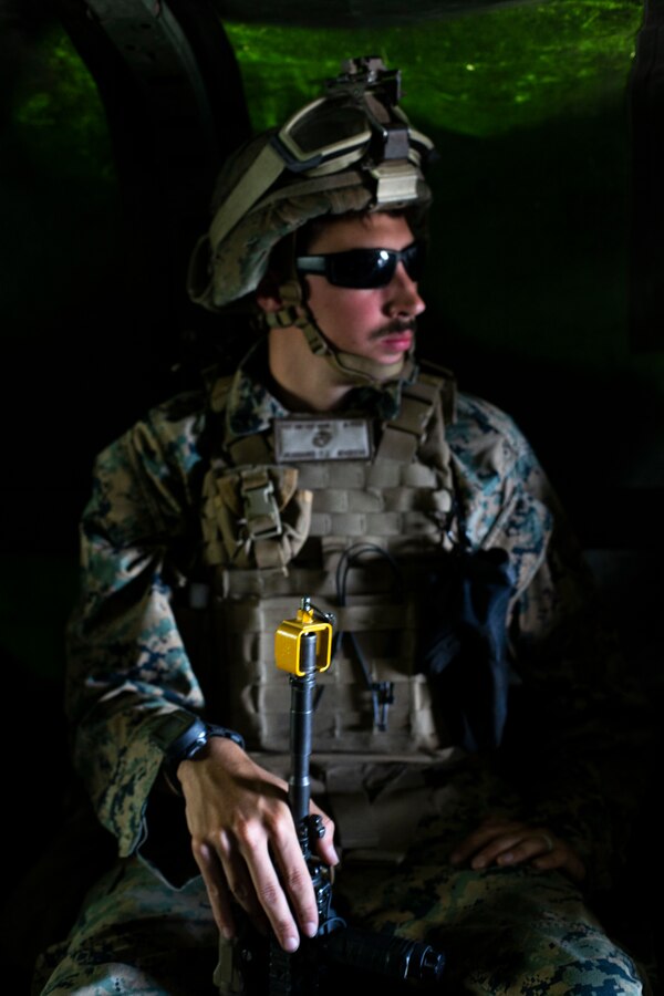 U.S. Marine Corps Lance Cpl. Dakota Hubbard, a mortarman with Weapons Company, Battalion Landing Team 1/4, 15th Marine Expeditionary Unit, rides in a Medium Tactical Vehicle Replacement for a tactical recovery of aircraft and personnel training mission during realistic urban training at Marine Corps Air Station Camp Pendleton, California, June 6, 2020. TRAP training prepares Marines with the knowledge and skills to recover isolated sensitive material and personnel in the event of a downed aircraft. (U.S. Marine Corps photo by Lance Cpl. Mackenzie Binion)