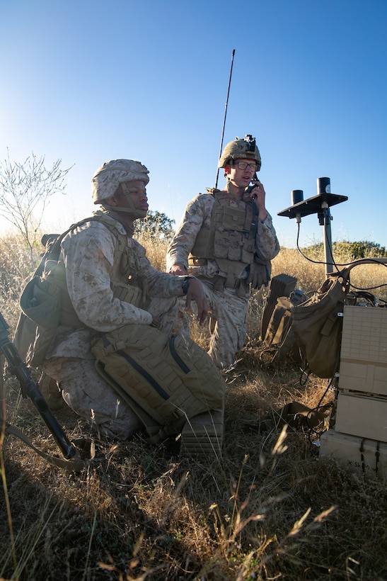 U.S. Marine Corps Lance Cpl. Jevon Thomas, left, and Lance Cpl. Jonathon Stevens, both low altitude air defense gunmen with 3rd Low Altitude Air Defense Battalion, 3rd Marine Aircraft Wing, provide security against unmanned aircraft with a Modi II Electronic Counter Measure system at a forward staging base during Realistic Urban Training, at Fort Hunter Liggett, California, June 08, 2020.