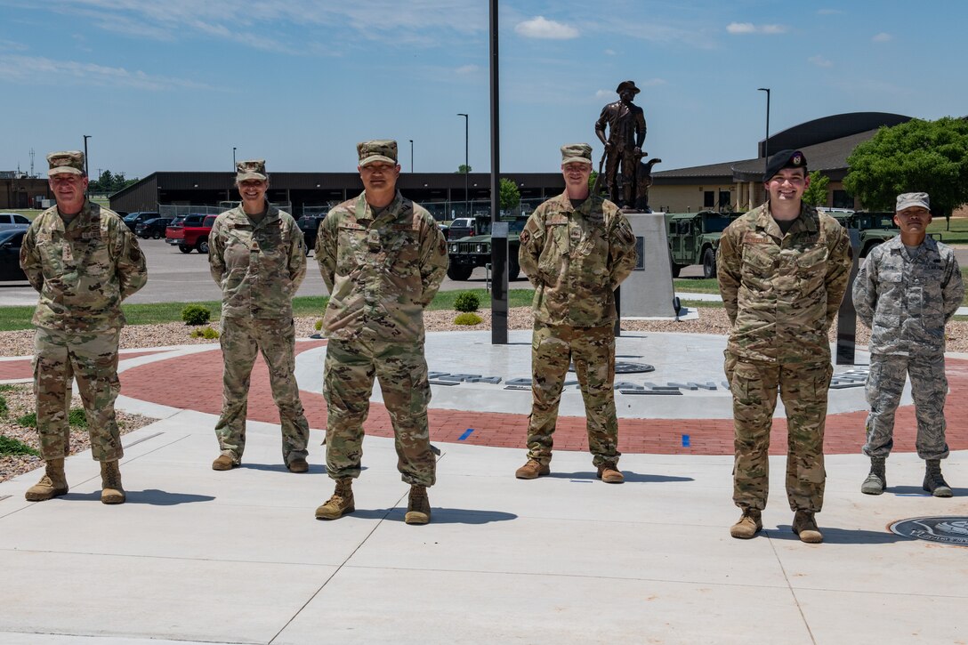 Air Force Chief of Staff Gen. David L. Goldfein poses alongside Airmen from around Will Rogers Air National Guard Base (WRANGB) after a coining ceremony in front of the Minuteman Memorial on base June 8, 2020, in Oklahoma City. The Airmen were nominated to receive a coin based on outstanding conduct and performance in their Guard careers.