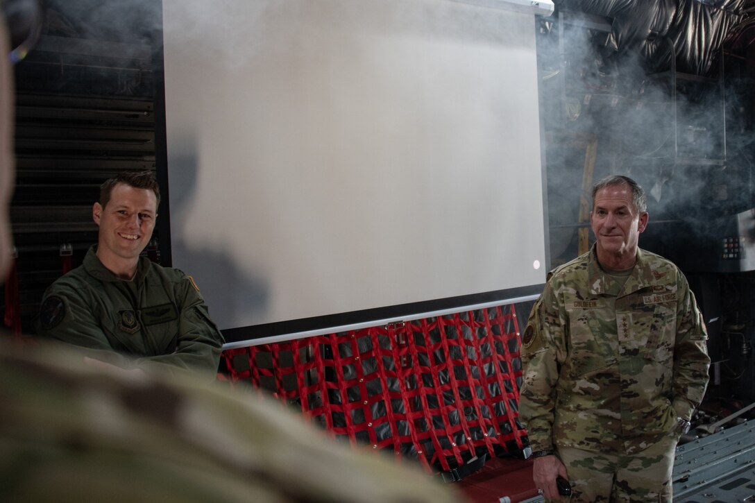 Air Force Chief of Staff Gen. David L. Goldfein stands in a haze of smoke as he listens alongside Maj. Morgan, training and innovation special projects officer for the 137th Special Operations Group, to a presentation on the base’s C-130 Hercules fuselage trainer by Maj. Jefferey Carlson, senior flight nurse examiner for the 137th Aeromedical Evacuation Squadron, during a base tour on June 8, 2020, at Will Rogers Air National Guard Base in Oklahoma City. The fuselage trainer is fully certified by the Air Mobility Command and can simulate any scenario that would happen on the aircraft in flight, including fire and smoke and a high-fidelity sound system to simulate rapid decompression.