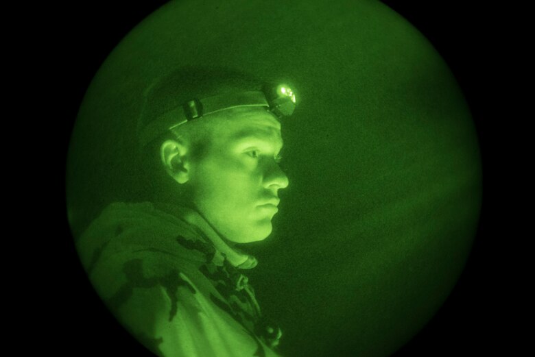 Senior Airman Adrian Montgomery, 4th Component Maintenance Squadron aerospace propulsion journeyman, listens to a briefing during combat survival training, near Brevard, North Carolina, May 22, 2020. After completing the training, Montgomery and four others earned the title of survival, evasion, resistance and escape augmentees. (U.S. Air Force photo by Senior Airman Kenneth Boyton)