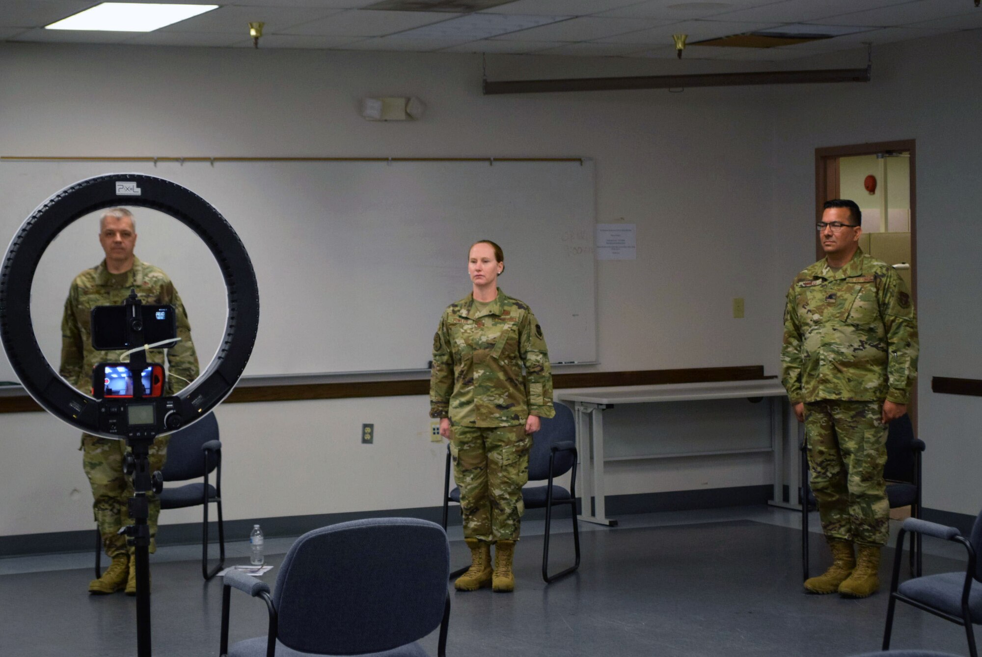 Col. Wayne M. Williams, 433rd Mission Support Group commander, Maj. Kristen B. Fowler, 74th Aerial Port Squadron commander, and Lt. Col. Brian A. Angell, 433rd Logistics Readiness Squadron commander, participate in a change of command ceremony June 6, 2020 at Joint Base San Antonio-Lackland, Texas.