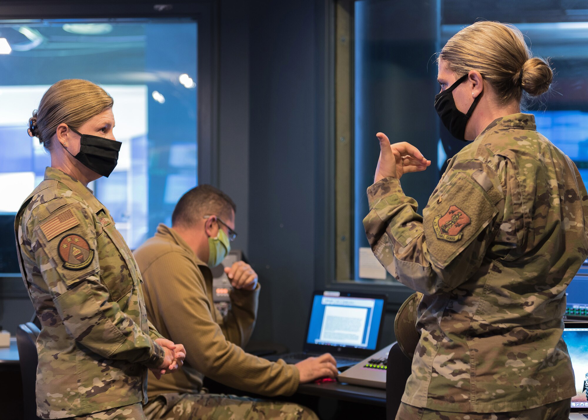 U.S. Air Force Tech.Sgt. Megan Francolini and Tech. Sgt. Renee Wiederspahn discuss enlisted professional military education recordings in the TEC-TV control room June 4, 2020, during recording sessions for virtual in-residence remote NCO academy for the total U.S. Air Force. TEC’s Lankford EPME Center in East Tennessee kicks off VIR-R NCO Academy as well as VIR-R Airman leadership school for more than 250 students, connected across the nation, beginning June 15. Sergeants Francolini and Wiederspahn are assigned to the center as PME instructors. (U.S. Air National Guard photo/Master Sgt. Mike R. Smith)