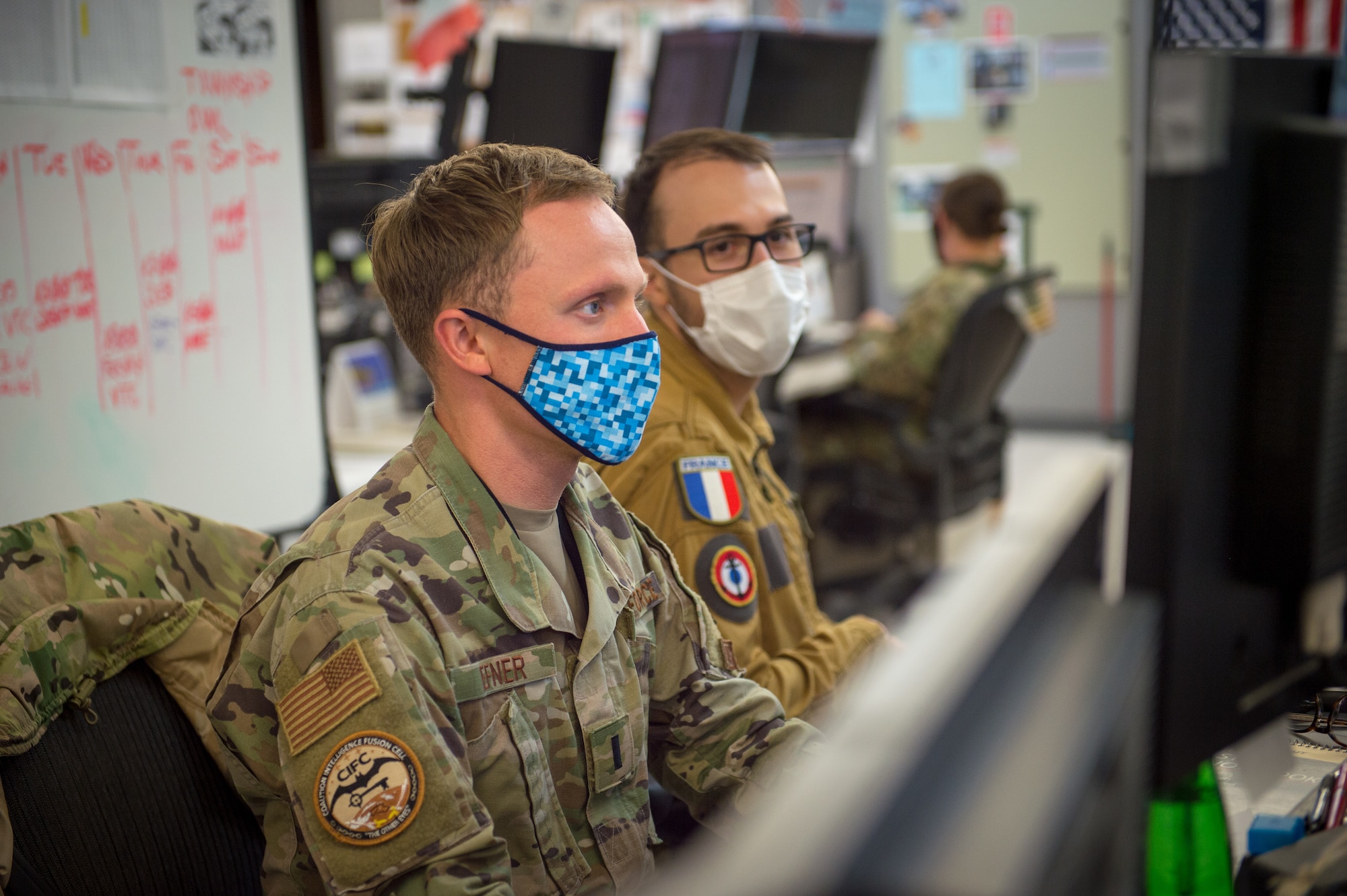 U.S. Air Force 2nd Lt. Kyle Hefner and French Naval Lt. j.g, Octave, targeeteers assigned to the Coalition Intelligence Fusion Cell, 609th Air Operations Center, U.S. Air Forces Central Command, Al Udeid Air Base, Qatar, collaborate daily to provide intelligence support. Targeeters are specially trained to analyze a target and develop solutions to support the commander’s objectives