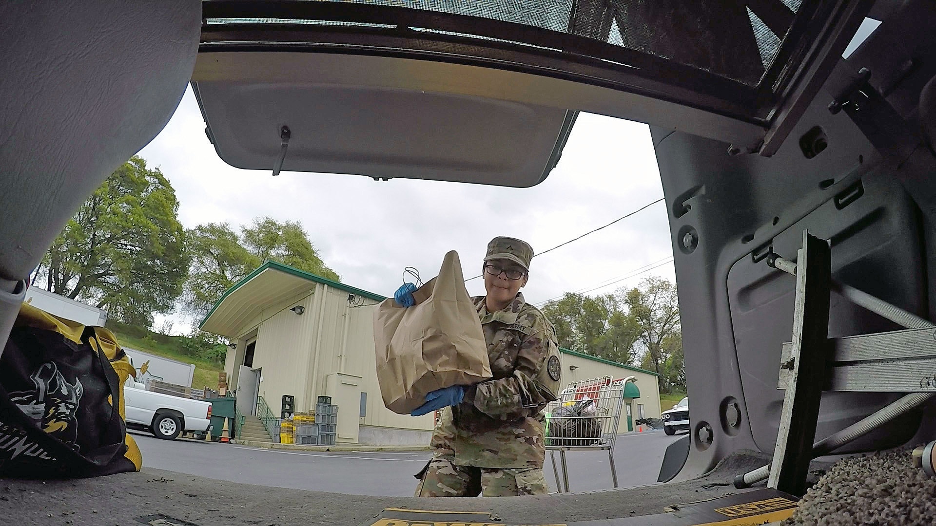 A member of the California Army National Guard assigned to Joint Task Force 115 loads food into a vehicle at the Interfaith Food Bank in Amador County, California, March 23, 2020. As of June 10, the California National Guard surpassed 50 million meals packed and distributed at food banks throughout the state since operations began in March as part of Cal Guard’s humanitarian response to the coronavirus pandemic.