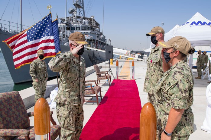 Vice Adm. Jim Malloy, commander of U.S. Naval Forces Central Command, U.S. 5th Fleet and Combined Maritime Forces, left, salutes Cmdr. Samantha A. Dutily, front right, and Capt. William Snyder, back right, during a change of command ceremony for Commander Naval Surface Squadron (CNSS) 5. CNSS 5 serves as the surface type commander's executive agent in Bahrain and provides support to 10 Cyclone-class patrol coastal ships and four Avenger-class mine countermeasures ships in the U.S. 5th Fleet area of operations (AOO). (U.S Navy photo by Mass Communication Specialist 3rd Class Dawson Roth)