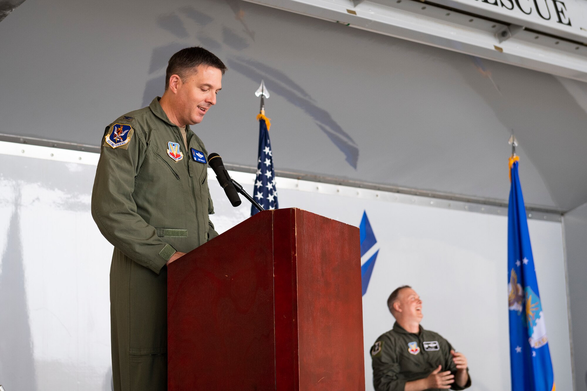 A photo of the 23d Wing commander addressing attendees at a change of command ceremony