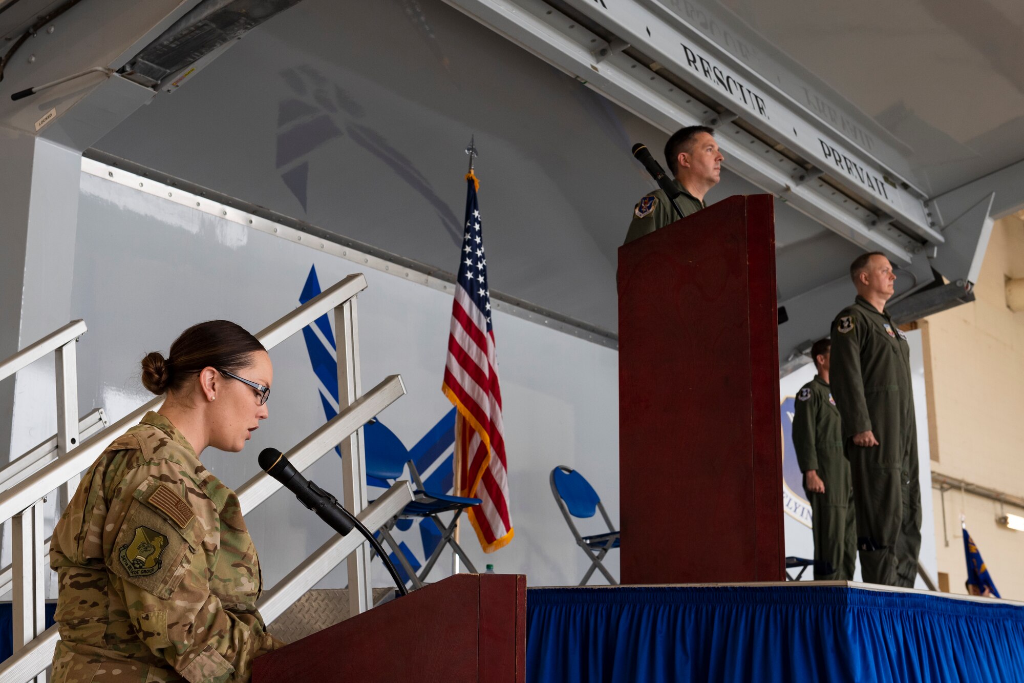 A photo of the rescue group's change of command master of ceremonies reading a Legion of Merit citation