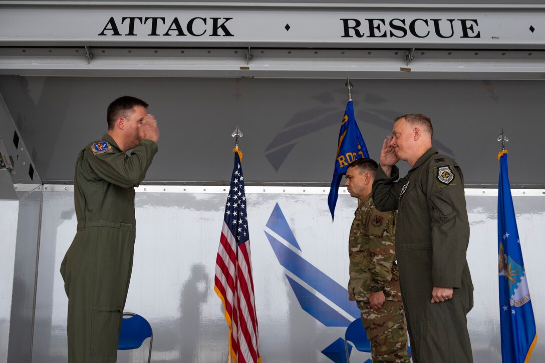 A photo of the 347th Rescue Group commander saluting the 23d Wing commander
