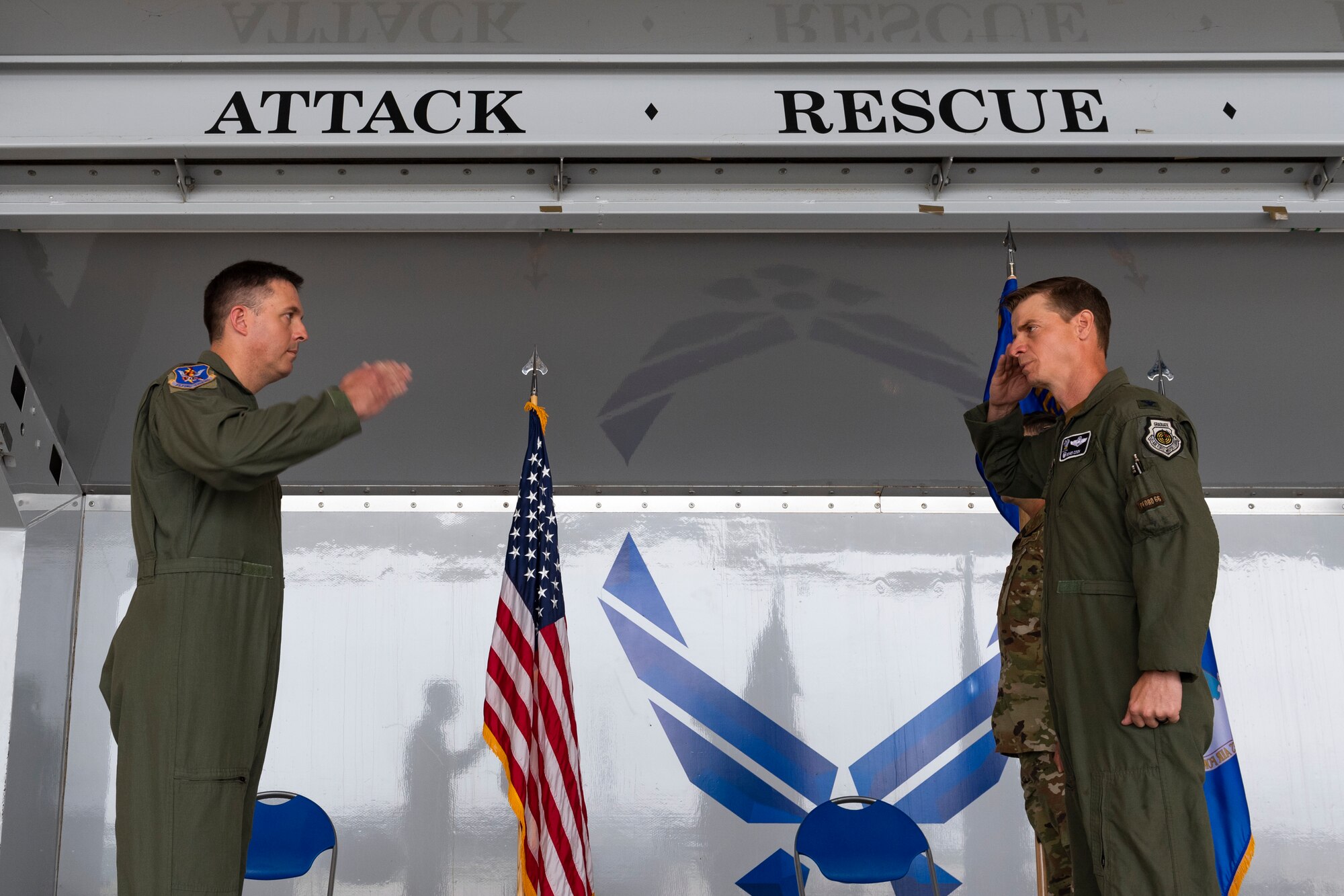 A photo of the 347th Rescue Group commander saluting the 23d Wing commander
