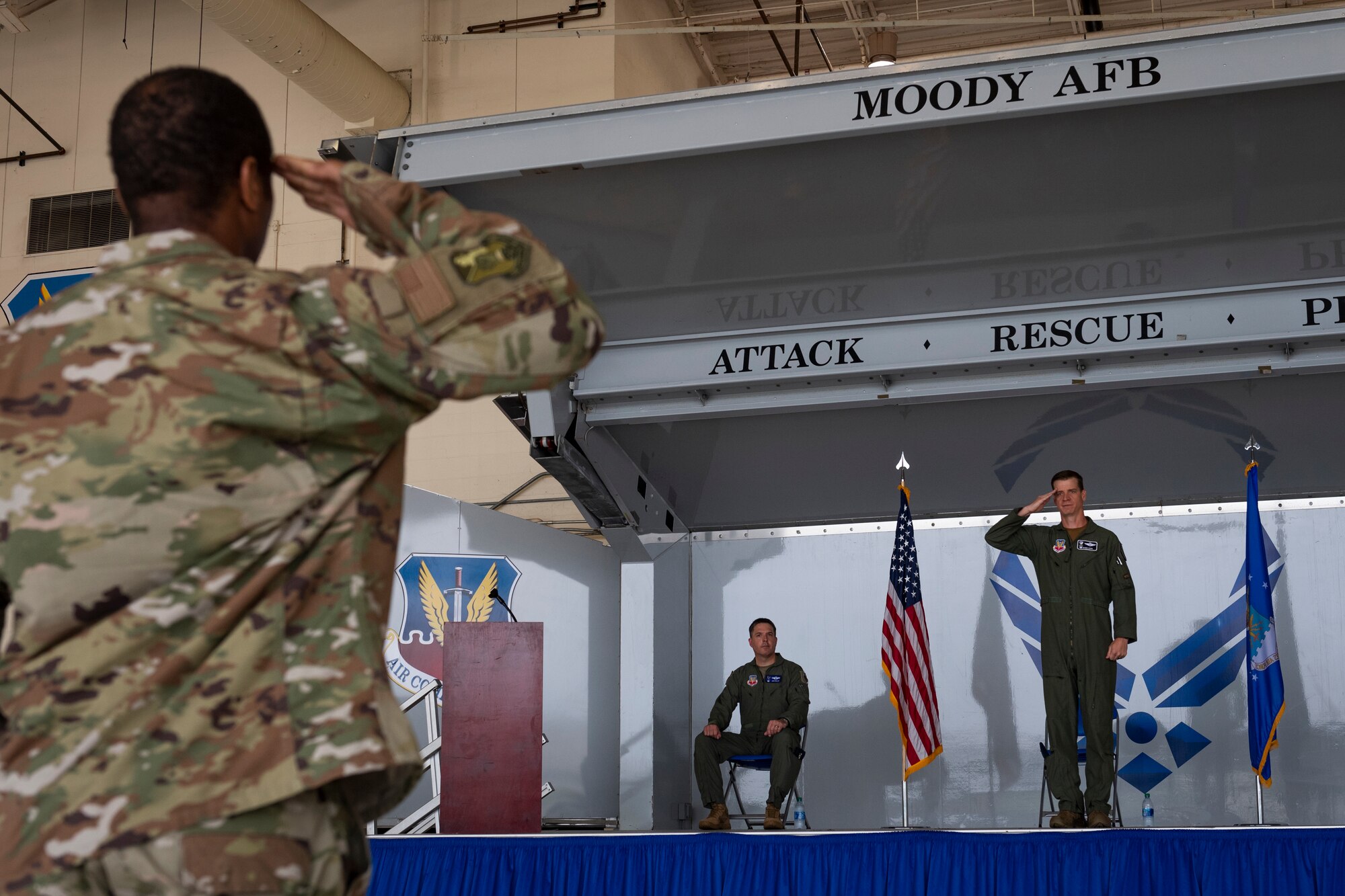 A photo of an Airman saluting the commander of the rescue group