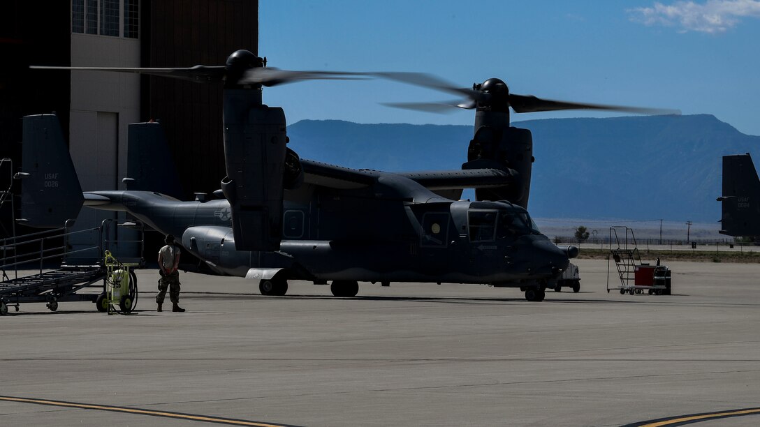 Airmen inspect an aircraft.