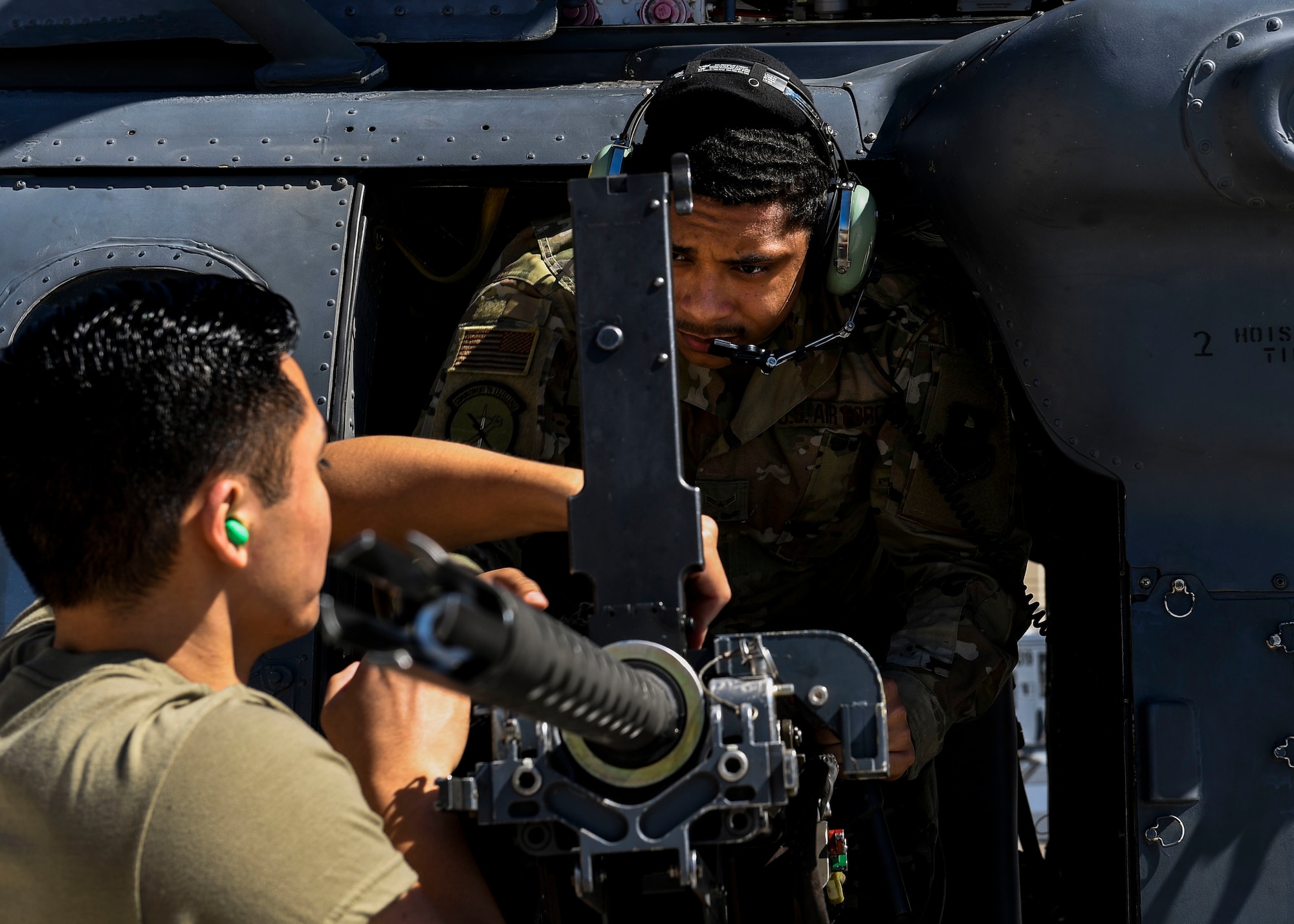 Airmen inspect aircraft components.