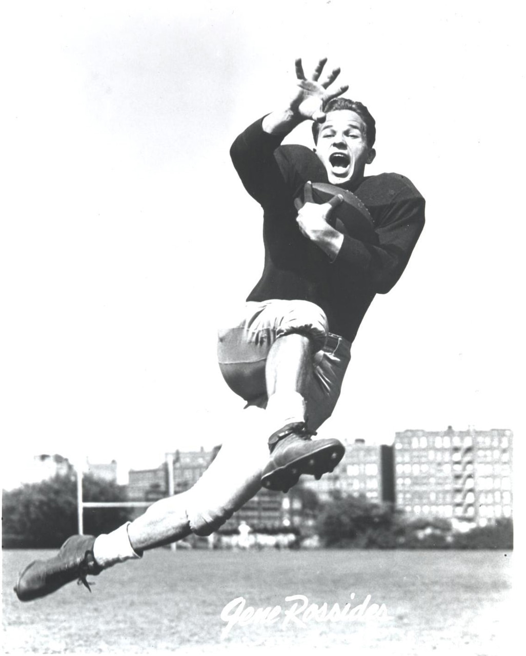 A football player strikes a tackle-evasion pose.