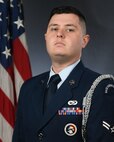 Senior Airman Christian Graham, a crew chief assigned to the 437th Aircraft Maintenance Squadron, poses for an official photograph at Joint Base Charleston, S.C. Graham won the Base Honor Guard Member of the Year award in the annual Air Mobility Command awards.