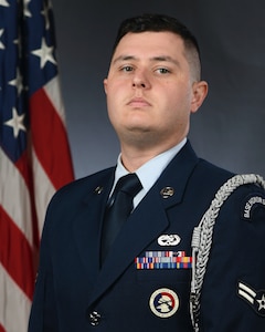 Senior Airman Christian Graham, a crew chief assigned to the 437th Aircraft Maintenance Squadron, poses for an official photograph at Joint Base Charleston, S.C. Graham won the Base Honor Guard Member of the Year award in the annual Air Mobility Command awards.