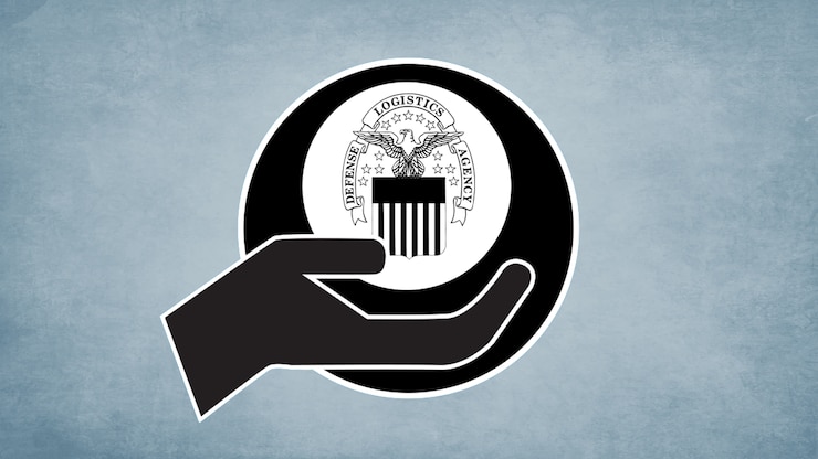 A hand, palm upward, holding the DLA seal