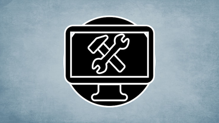 A simplified illustration of a computer monitor with a wrench and hammer crossed on the screen