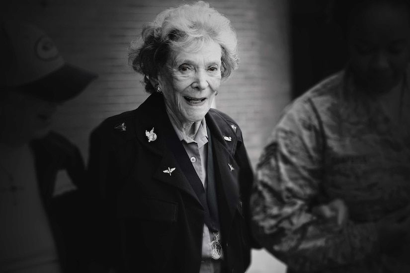 Woman wearing World War II uniform.