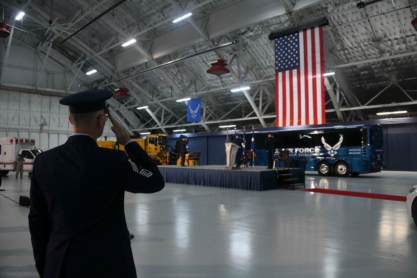Chief Master Sgt. Harold Kruger, Air Force District of Washington superintendent, salutes the American flag during the playing of the National Anthem at Hangar 3 on Joint Base Andrews, Md., June 11, 2020. This ceremony included the inactivation of the 11th Wing and reactivation of the 316th Wing in addition to the change of command. (U.S. Air Force photo by Airman 1st Class Spencer Slocum)