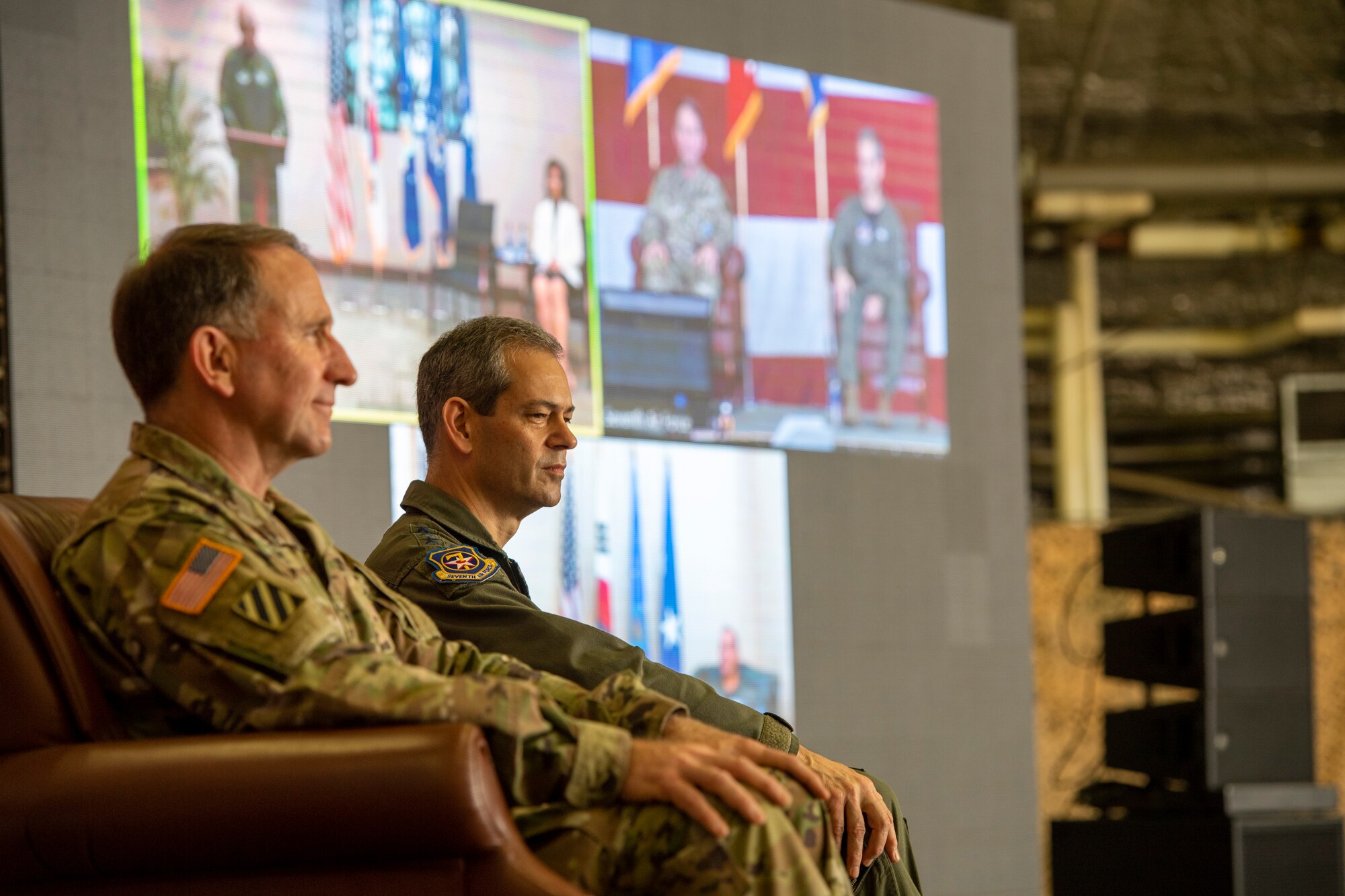Gen. Robert “Abe” Abrams, Commander, United Nations Command/Combined Forces Command/United States Forces Korea, and Lt. Gen. Kenneth S. Wilsbach, listen to Gen. CQ Brown, Jr., Commander, Pacific Air Forces, deliver a speech virtually at Osan Air Base, ROK, June 12, 2020. Brown presided over the Seventh Air Force change of command from Wilsbach, to Lt. Gen. Scott L. Pleus. (U.S. Air Force photo by Senior Airman Darien Perez)