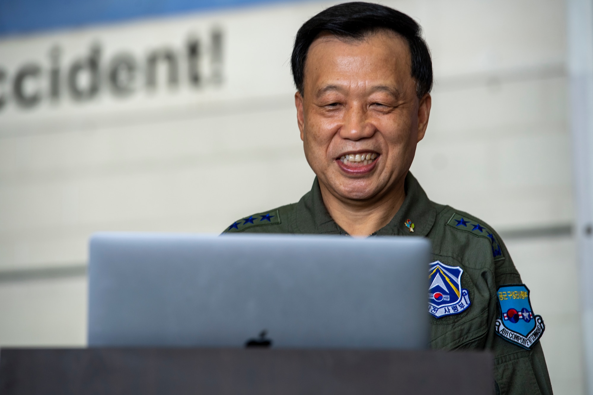 Lt. Gen. Hwang Seong Jin, Air Component Command deputy commander and Air Force Operations Command commander, Republic of Korea, greets Lt. Gen. Scott L. Pleus, Seventh Air Force commander, virtually at Osan Air Base, ROK, June 12, 2020. Pleus was in quarantine due to COVID-19 mitigation measures. (U.S. Air Force photo by Senior Airman Darien Perez)