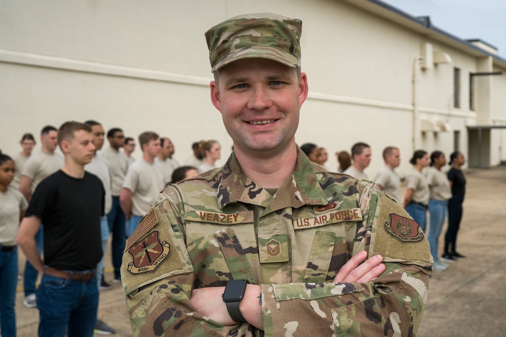 Master Sgt. Kenneth Veazey, 403rd Wing Development and Training Flight chief, poses for a photo with his trainees Feb. 9 at Keesler Air Force Base, Miss. Veazey prepares approximately 55 trainees during the monthly Unit Training Assembly for the Air Force’s Basic Military Training. (U.S. Air Force photo by Christopher Carranza)