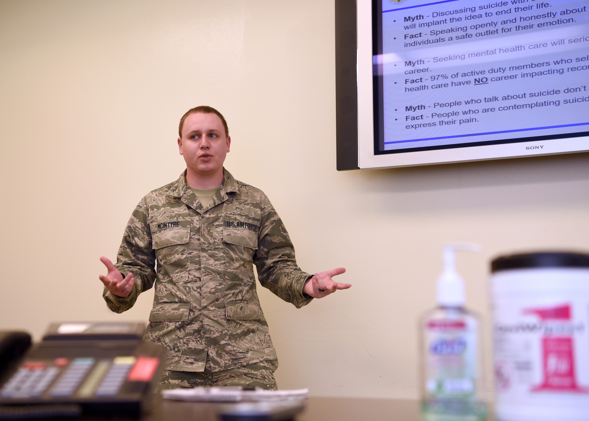 U.S. Air Force Airman 1st Class Eugene McIntyre, 17th Medical Group mental health technician, practices a mental health awareness brief in the mental health clinic conference room on Goodfellow Air Force Base, Texas, June 5, 2020.  McIntyre enlisted with an open general AFSC and was offered the mental health technician position while undergoing Basic Military Training. (U.S. Air Force photo by Airman 1st Class Abbey Rieves)