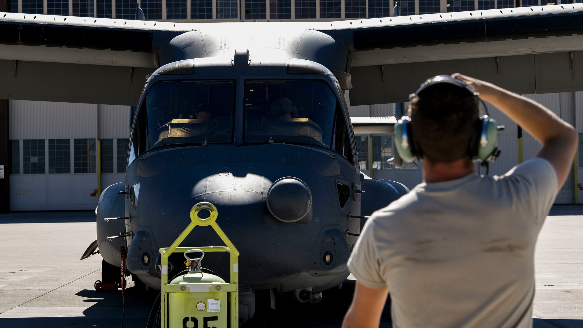 An Airman performs a pre-flight inspection.