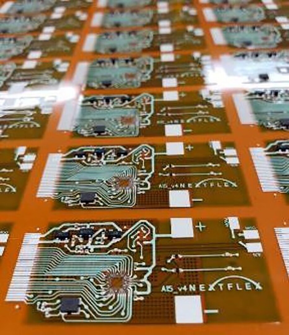 The NextFlex Flexible Microcontroller Platform was initially sponsored by the Air Force Research Laboratory and manufactured at NextFlex. The goal was to develop a flexible version of the ArduinoTM  Mini Microcontroller board to validate the ability to mass produce printed hybrid electronics and create a platform for future applications. (Photo courtesy NextFlex)