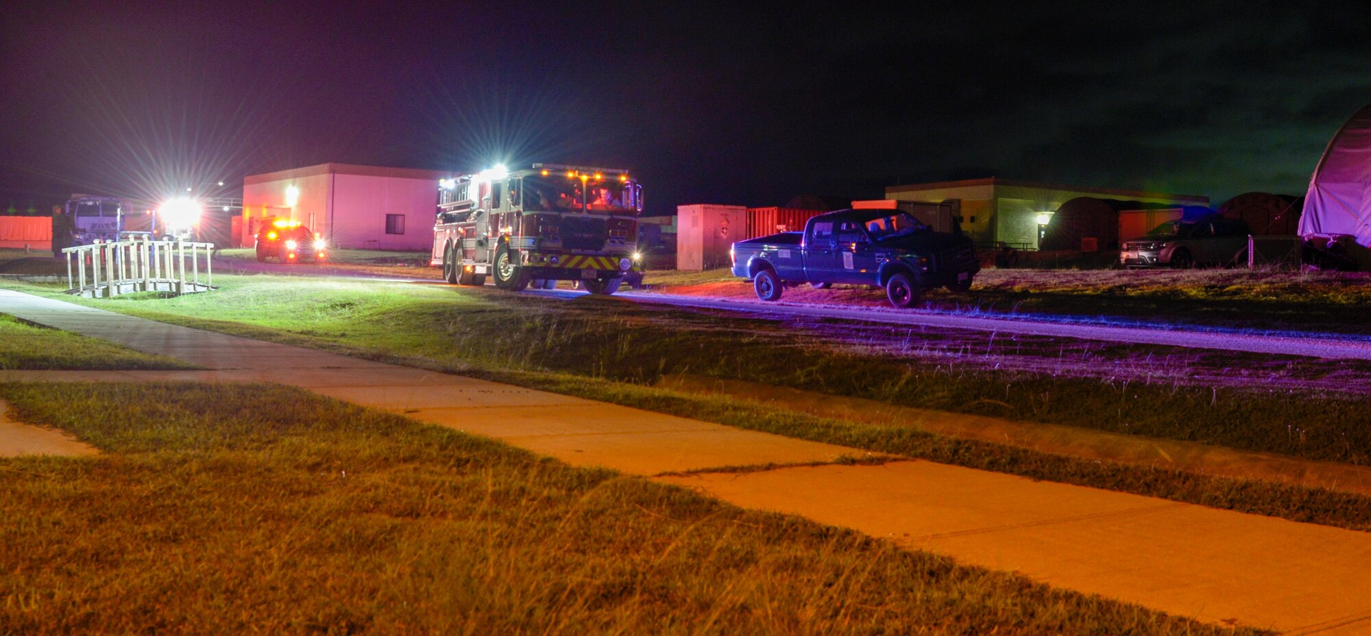 Emergency responder's vehicle line the street.