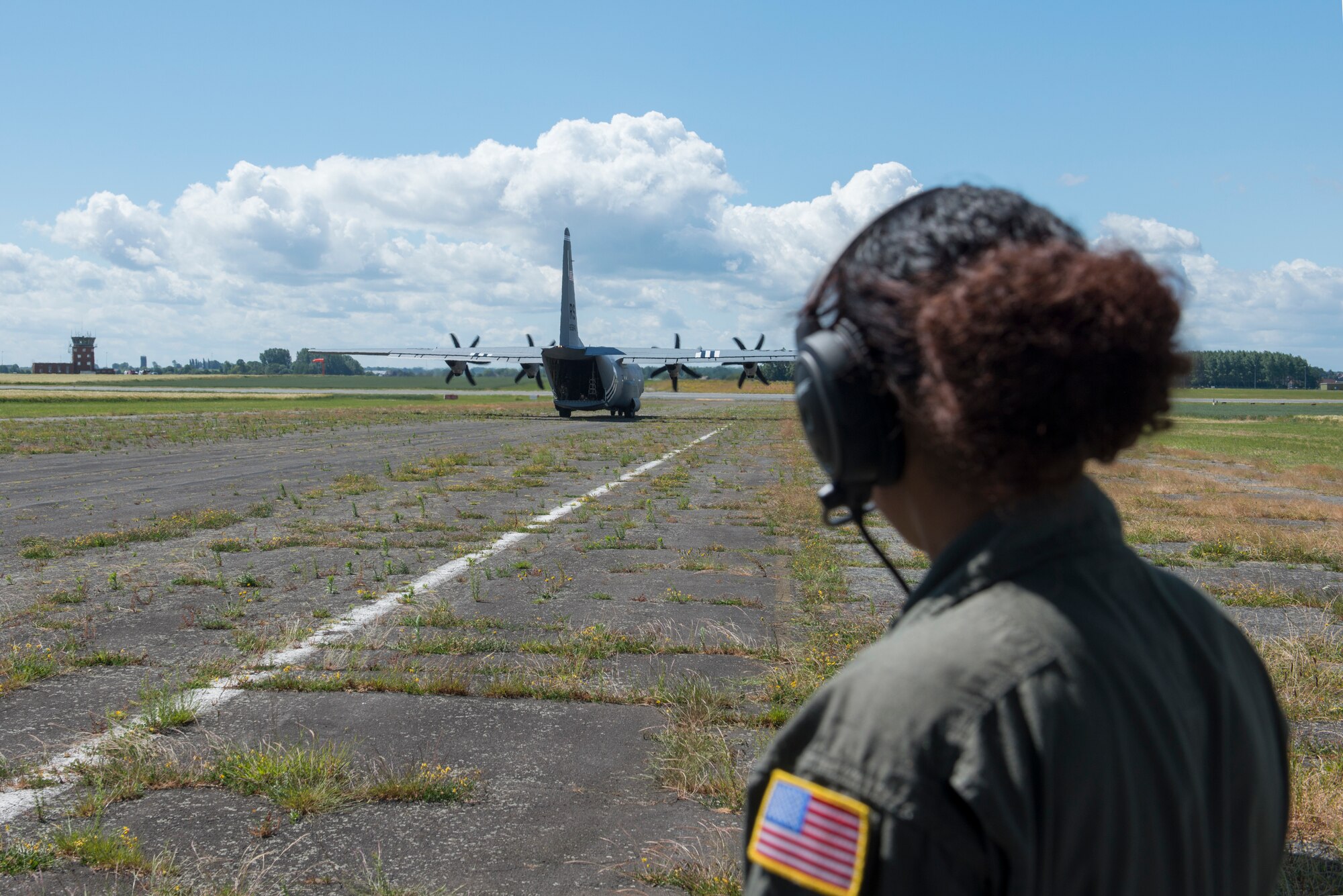 A photo of an Airman looking at an aircraft.
